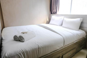 Homey and Cozy 2BR at Jarrdin Cihampelas Apartment By Travelio